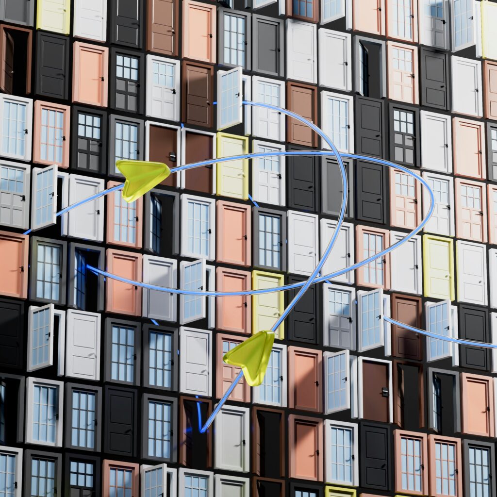 Colorful building facade with open doors and sculptures.